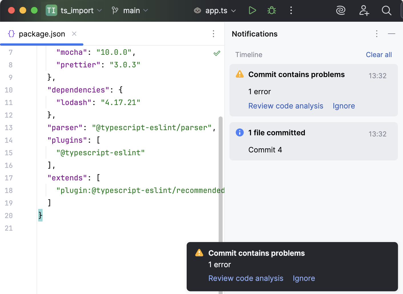 Notification balloon warning about commit problems with options to review code analysis in the bottom right corner